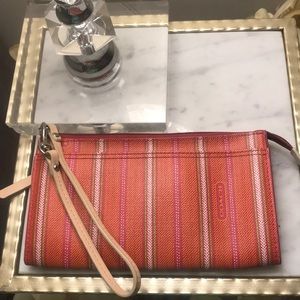 Authentic coach clutch